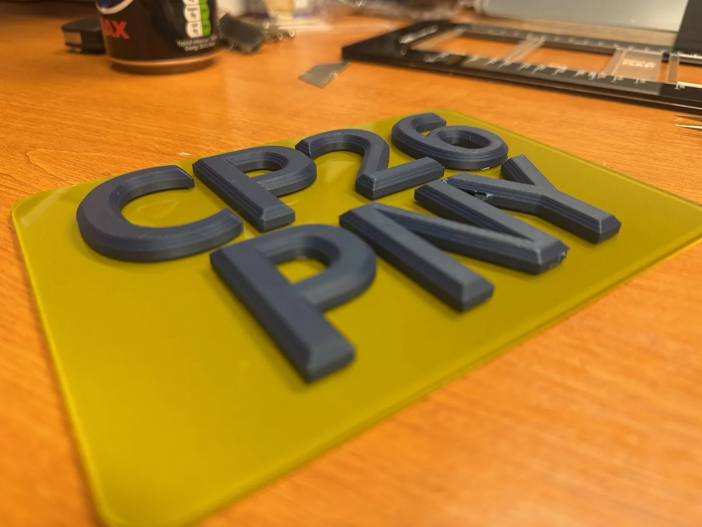 Custom raised number plate characters in production